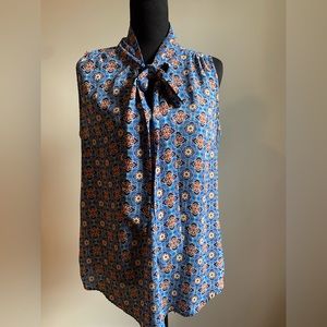 Blue sleeveless blouse with patterns no size or brand tag